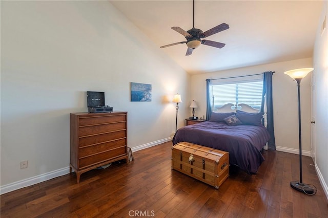 bedroom with ceiling fan, dark hardwood / wood-style flooring, and vaulted ceiling