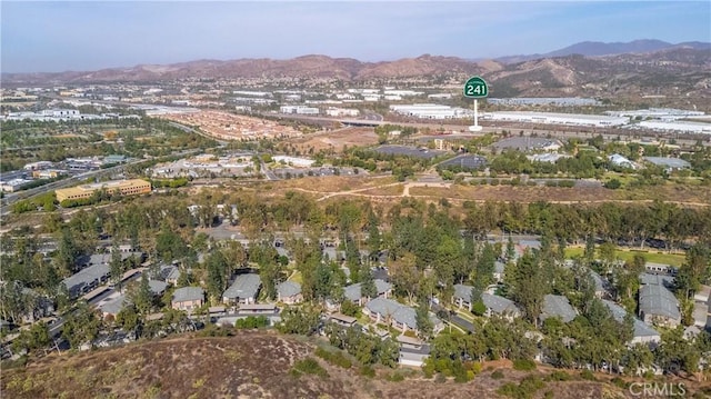 birds eye view of property with a mountain view