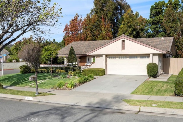 single story home with a front yard and a garage