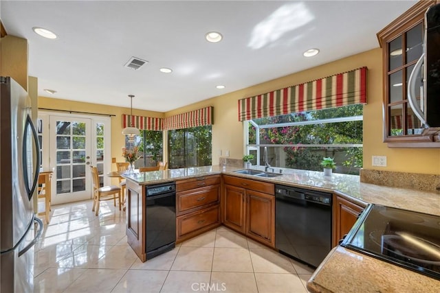 kitchen with kitchen peninsula, black dishwasher, light tile patterned flooring, stainless steel refrigerator, and sink