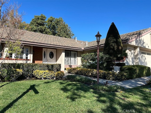 ranch-style house with a front yard