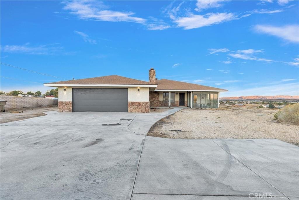 ranch-style house featuring a mountain view and a garage