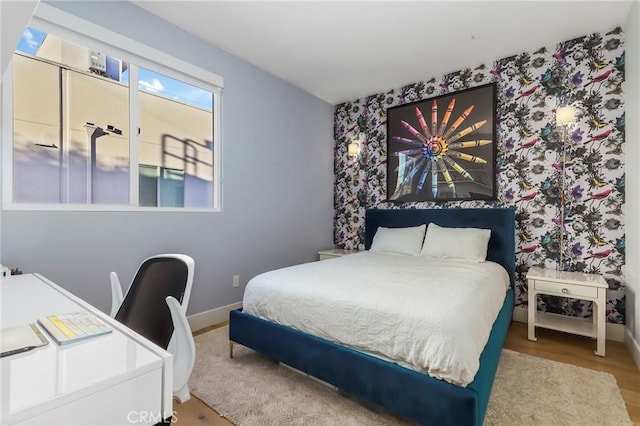 bedroom with hardwood / wood-style floors