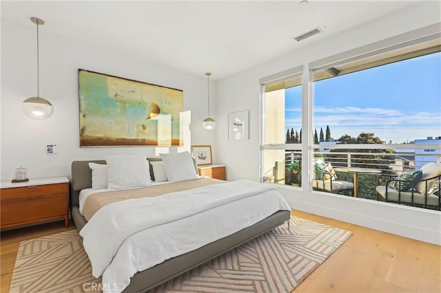 bedroom with hardwood / wood-style flooring