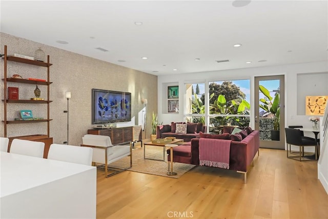 living room with light hardwood / wood-style flooring