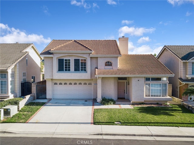 mediterranean / spanish home with a front yard and a garage