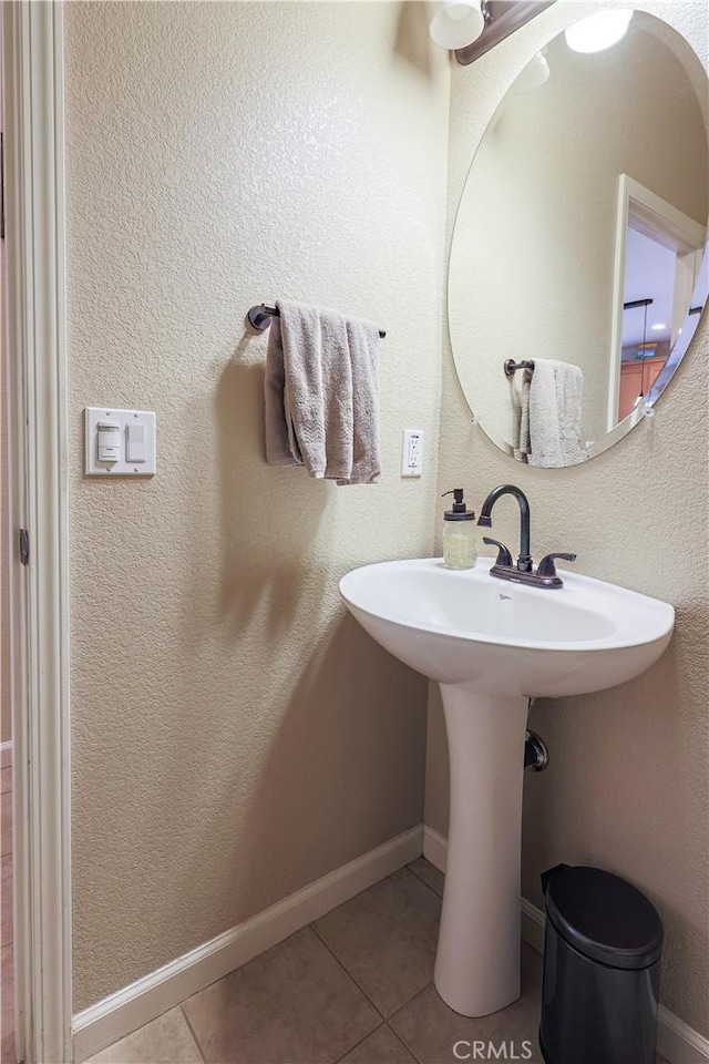 bathroom featuring tile patterned flooring and sink