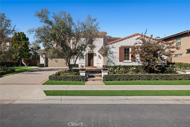 mediterranean / spanish-style home with a garage