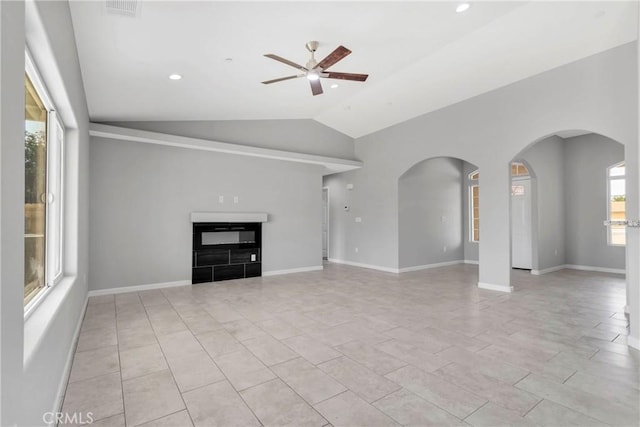 unfurnished living room featuring ceiling fan and lofted ceiling