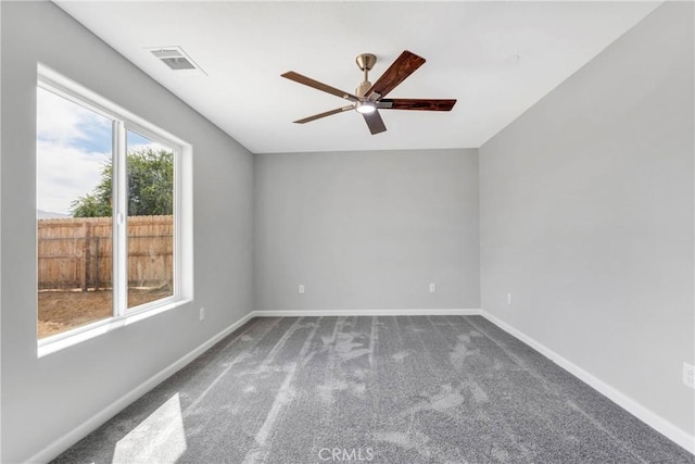 carpeted empty room featuring ceiling fan