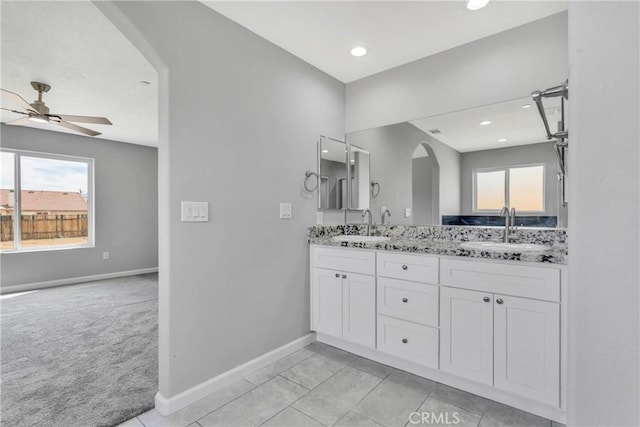 bathroom featuring tile patterned floors, ceiling fan, and vanity