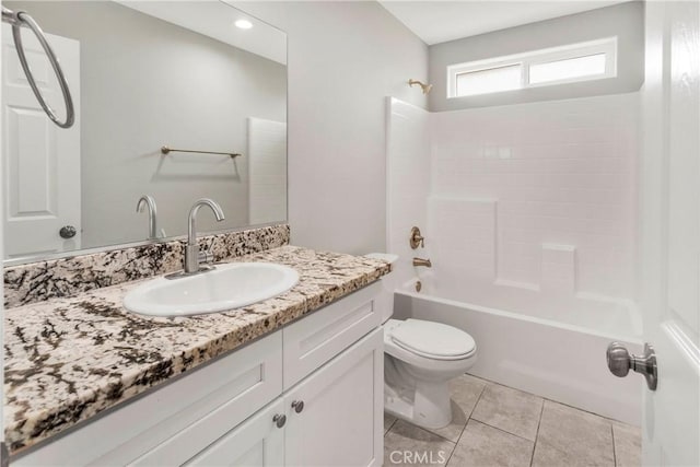 full bathroom featuring tile patterned floors, vanity, toilet, and washtub / shower combination