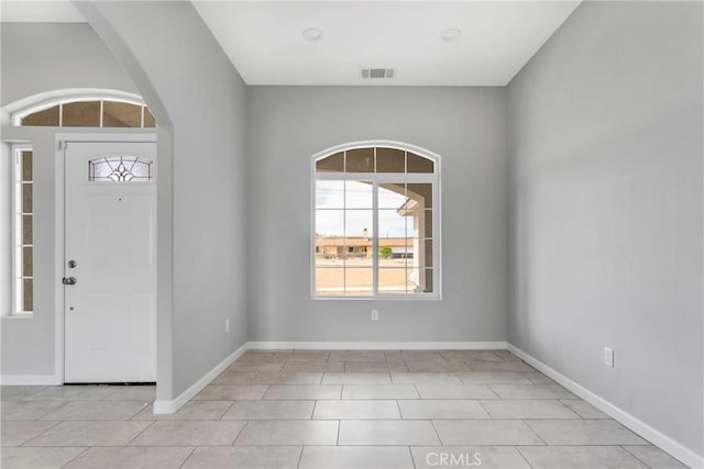 foyer entrance featuring light tile patterned floors