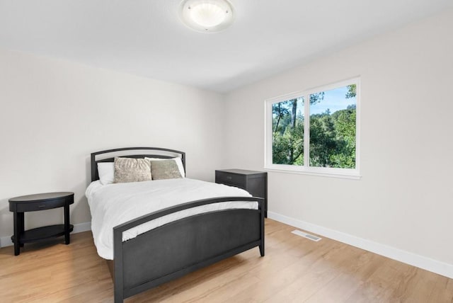 bedroom with light hardwood / wood-style floors