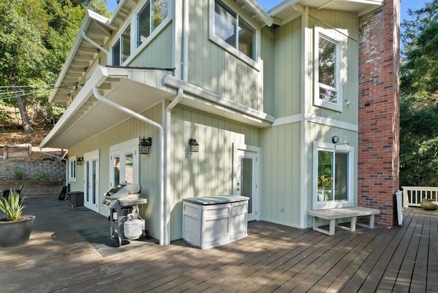 rear view of house featuring french doors and a deck