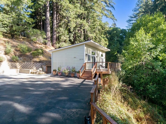 view of side of home with a deck