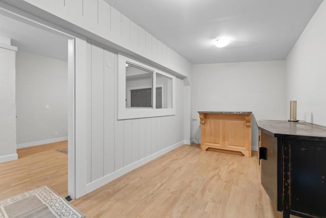 bar with light hardwood / wood-style floors