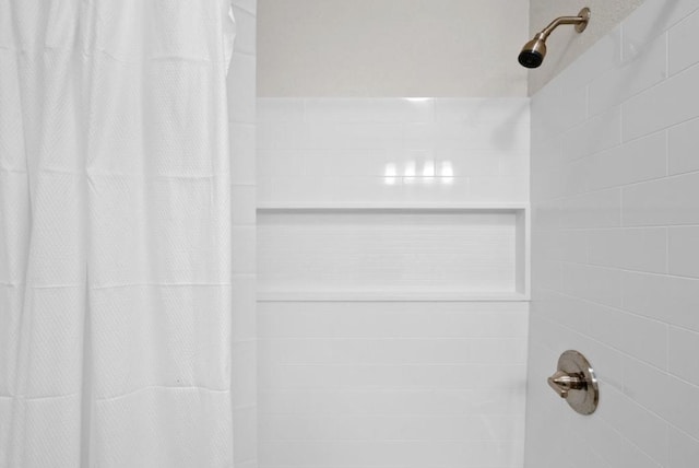 bathroom featuring curtained shower