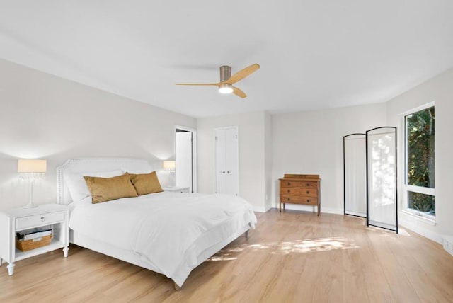 bedroom featuring ceiling fan and light hardwood / wood-style floors