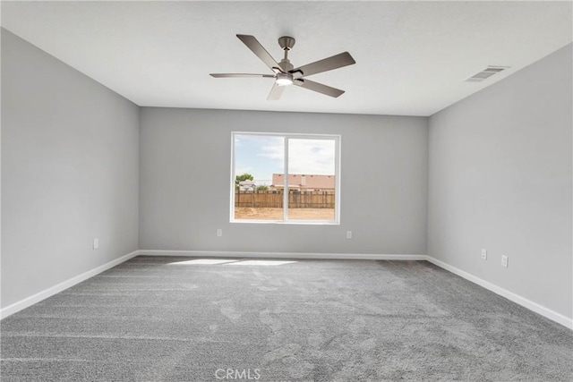 empty room with carpet and ceiling fan