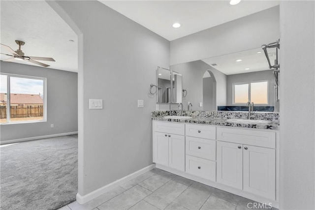 bathroom featuring tile patterned floors, ceiling fan, and vanity