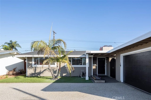 single story home featuring a garage