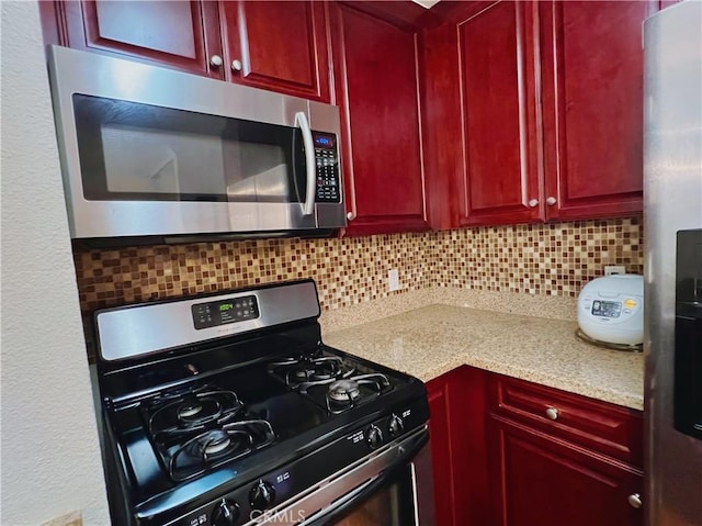 kitchen featuring decorative backsplash and stainless steel appliances