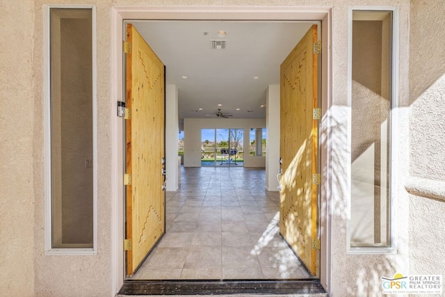 corridor featuring light tile patterned floors