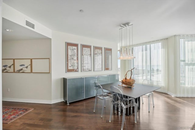 dining area with dark wood-type flooring