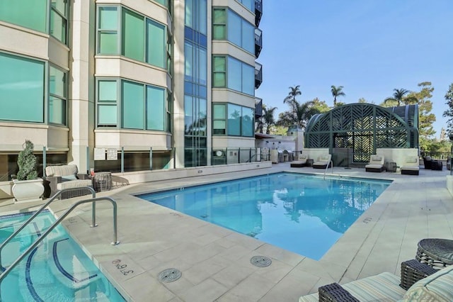 view of swimming pool with a patio