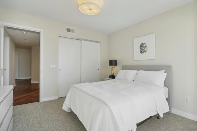 bedroom with carpet floors and a closet