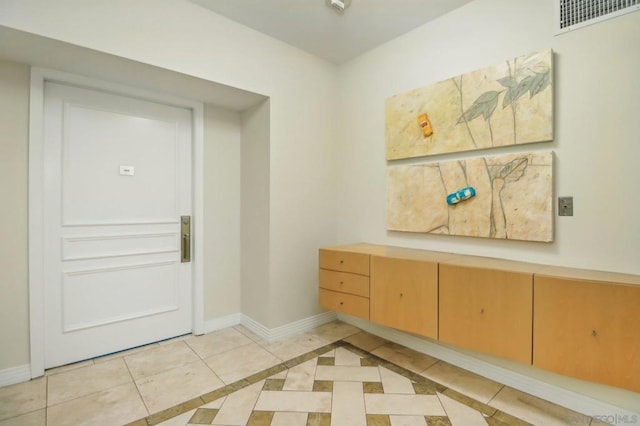 interior space featuring light tile patterned floors