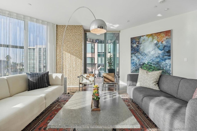 living room featuring floor to ceiling windows