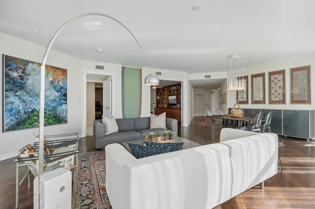 living room featuring dark hardwood / wood-style floors