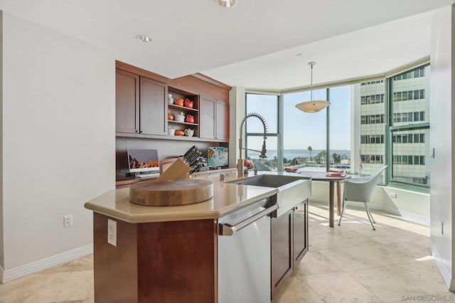 kitchen featuring sink, stainless steel dishwasher, a center island with sink, and decorative light fixtures