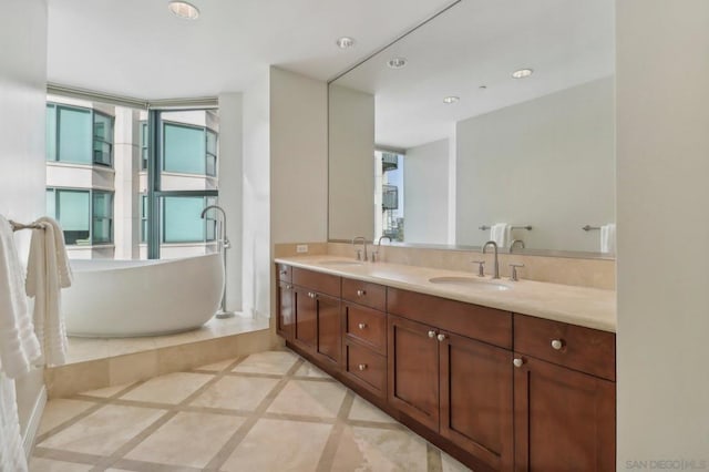 bathroom with a bathing tub and vanity