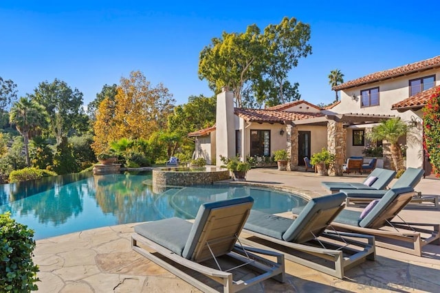 view of pool featuring a patio