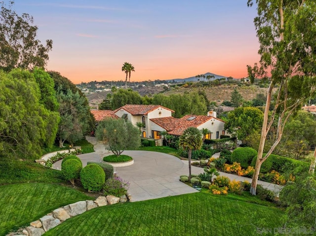 view of home's community with a lawn