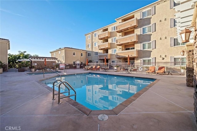 view of pool featuring a patio