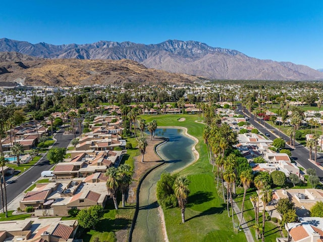 aerial view featuring a water and mountain view