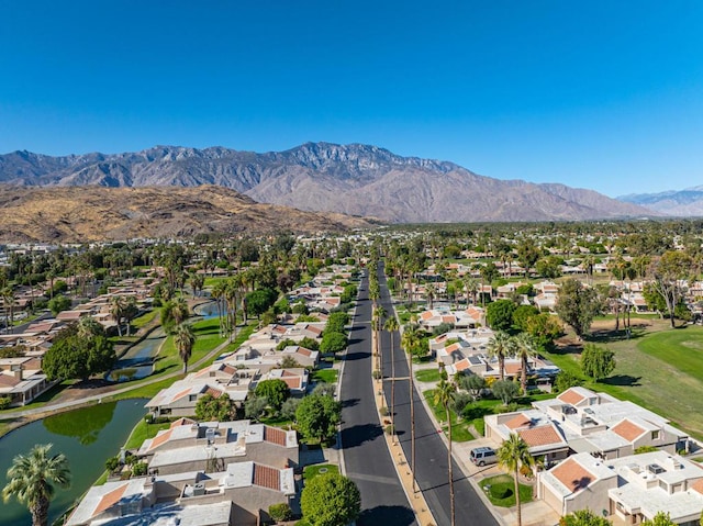 drone / aerial view featuring a water and mountain view