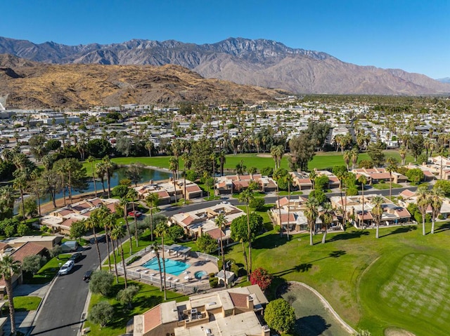 drone / aerial view featuring a water and mountain view