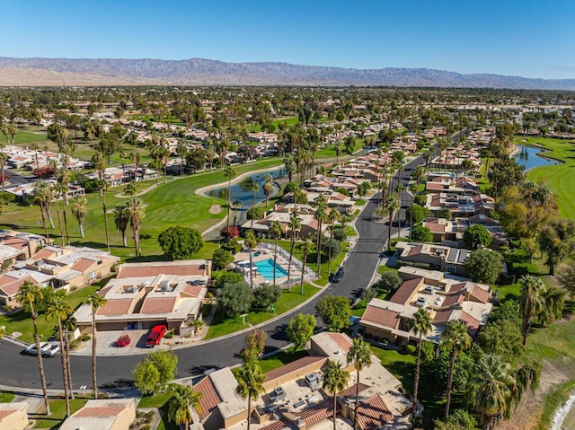 drone / aerial view with a water and mountain view