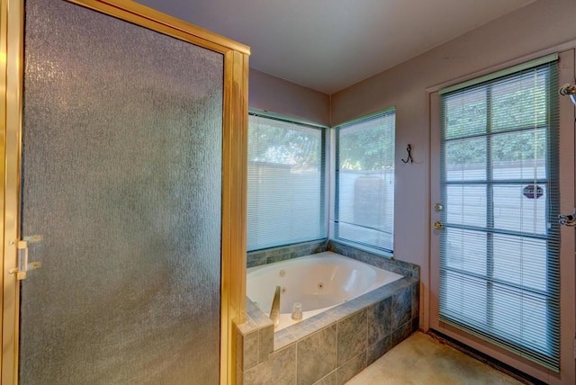 bathroom with plus walk in shower and a wealth of natural light