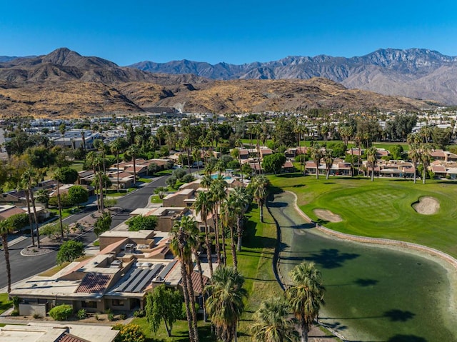 birds eye view of property with a mountain view