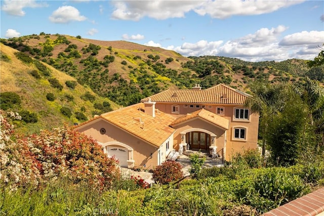 exterior space featuring a mountain view and a garage