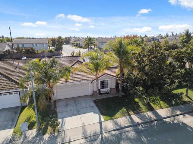 view of front of home with a garage and a front yard