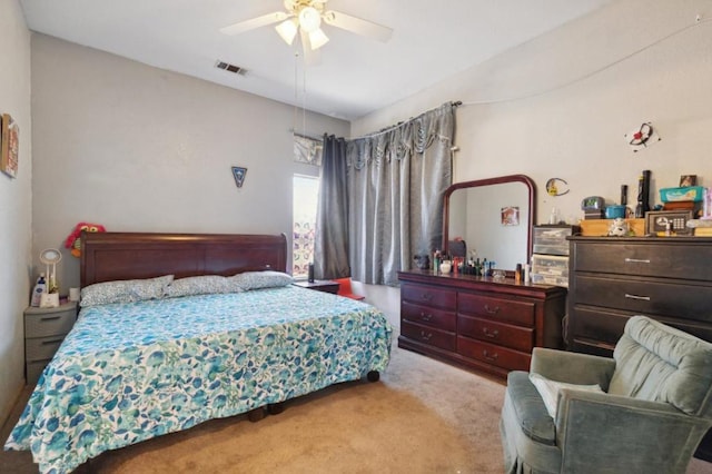 bedroom with light colored carpet and ceiling fan