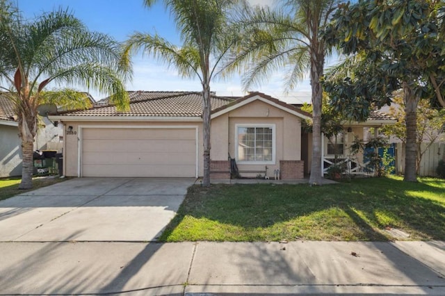 view of front of property featuring a garage and a front lawn