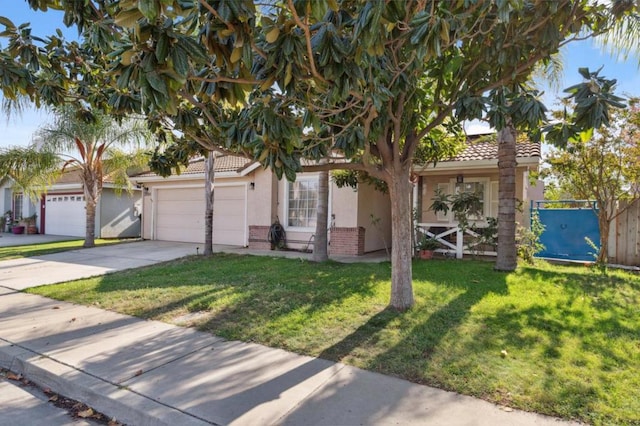 view of front of home with a garage and a front yard